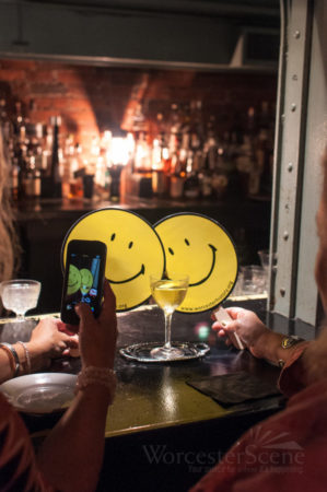 The "Liquid Smile" posing with two Smiley Faces during the committee cocktail tasting.