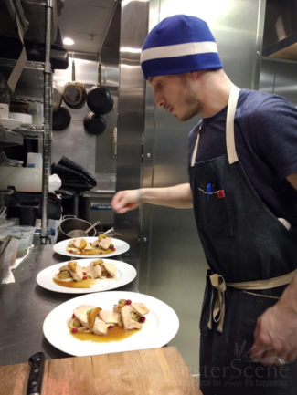 Damien Evangelous prepares Thanksgiving dinners in the kitchen of Armsby Abbey on Thanksgiving.