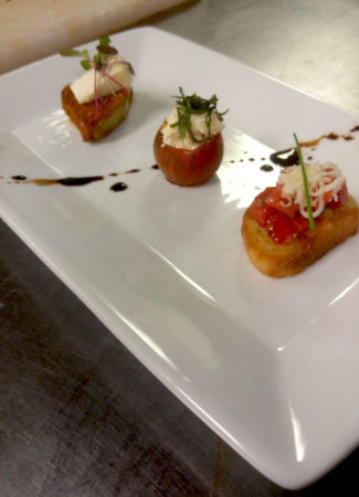 oven roasted peaches wrapped in local prosciutto with a baby greens salad