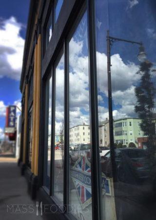 A painted facade and sign shows promise to a Spring opening.