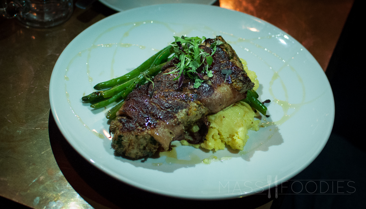 Porchetta, Roasted pork tenderloin wrapped in bacon, drizzled with local honey, mascarpone polenta, pan jus, and green beans from Hangover Pub on Green Street in Worcester, MA