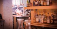 Executive Chef Jared Forman preparing meals while overlooking the dining room at deadhorse hill in Worcester, MA