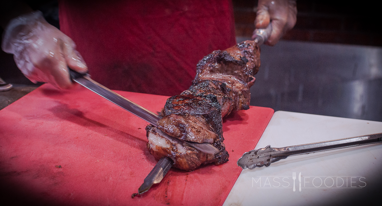Carefully slicing meat at Terra Brasilis on Shrewsbury Street in Worcester, MA