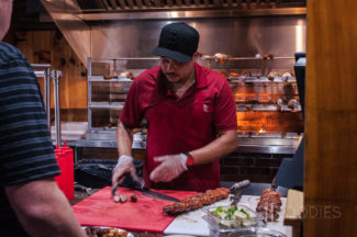 Carving meat from the skewer Terra Brasilis on Shrewsbury Street in Worcester, MA.