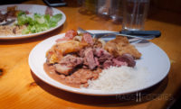A diner chooses her proteins, rice, and vegetables at Terra Brasilis buffet on Shrewsbury Street in Worcester, MA.