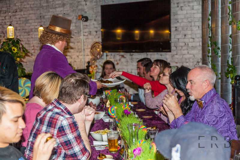 Willy Wonka passing out golden egg desserts.