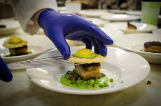 Preparing one of the courses at a 2016 dinner at VIA Italian Table.