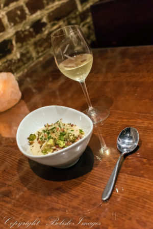 The first course from chef Tim Russo's Chef's Tasting Menu at Lock 50 in Worcester, MA. Celery root soup was topped with apple slaw, crispy Brussels sprout leaves, crumbled bacon, and fresh oregano