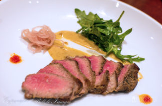 The fourth course from chef Tim Russo's Chef's Tasting Menu at Lock 50 in Worcester, MA - Seared tri-tip steak with soubise sauce