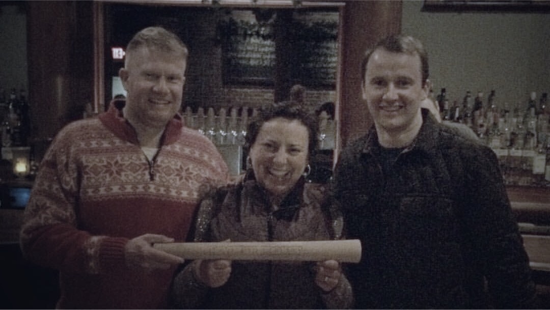 Ben, and Jenn pose with November Project leader, Sam Kanary at Armsby Abbey.