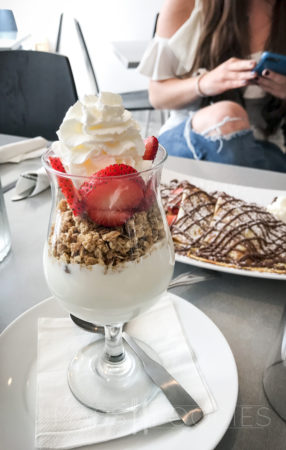 The first course, a yogurt and granola is set to pair with a mimosa to start out brunch on a social, light note.