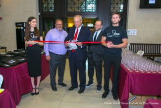 Worcester Mayor, Joe Petty, cutting the ribbon for Central Massachusetts' inaugural Worcester Wine Festival.