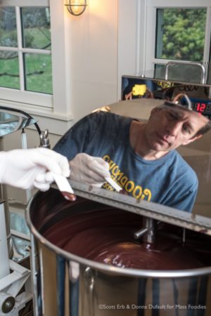 Tom tests fresh chocolate being ground smooth in the melanger (Erb Photography for Mass Foodies)