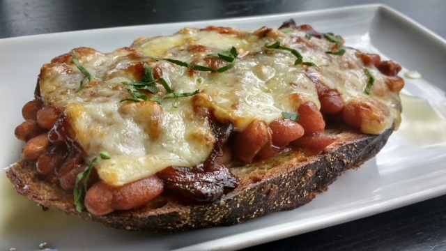 Brittany’s Toast-bbq baked beans, caramelized onions With bacon, melted sharp cheddar on country (BirchTree Bread Company)