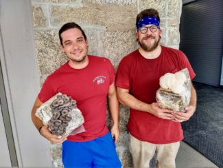 Brad pictured with Zack Slik outside their Sutton lab.