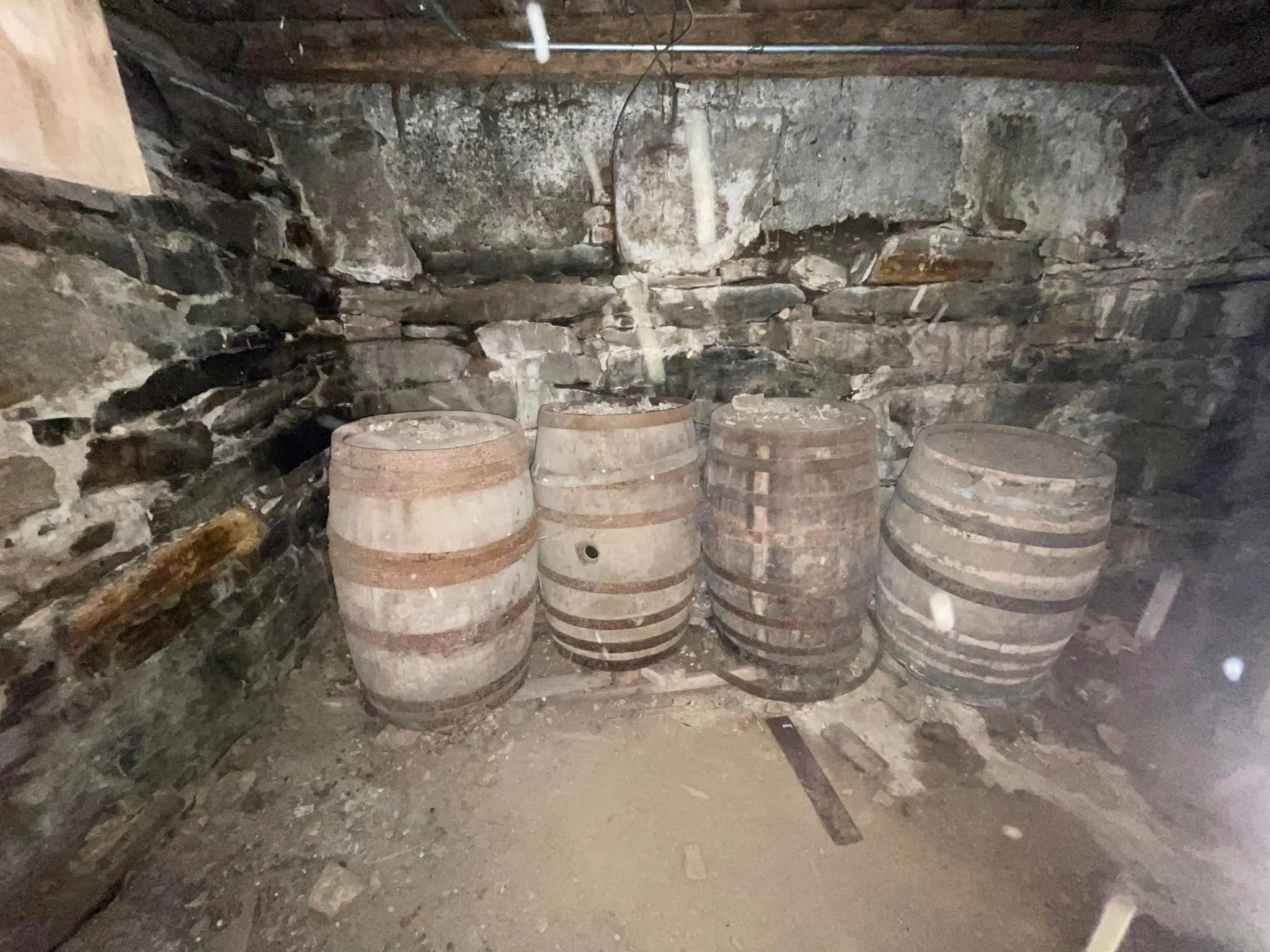hese whiskey barrels were likely used to mask the entrance to a secret room (photo by Christine Quirk)