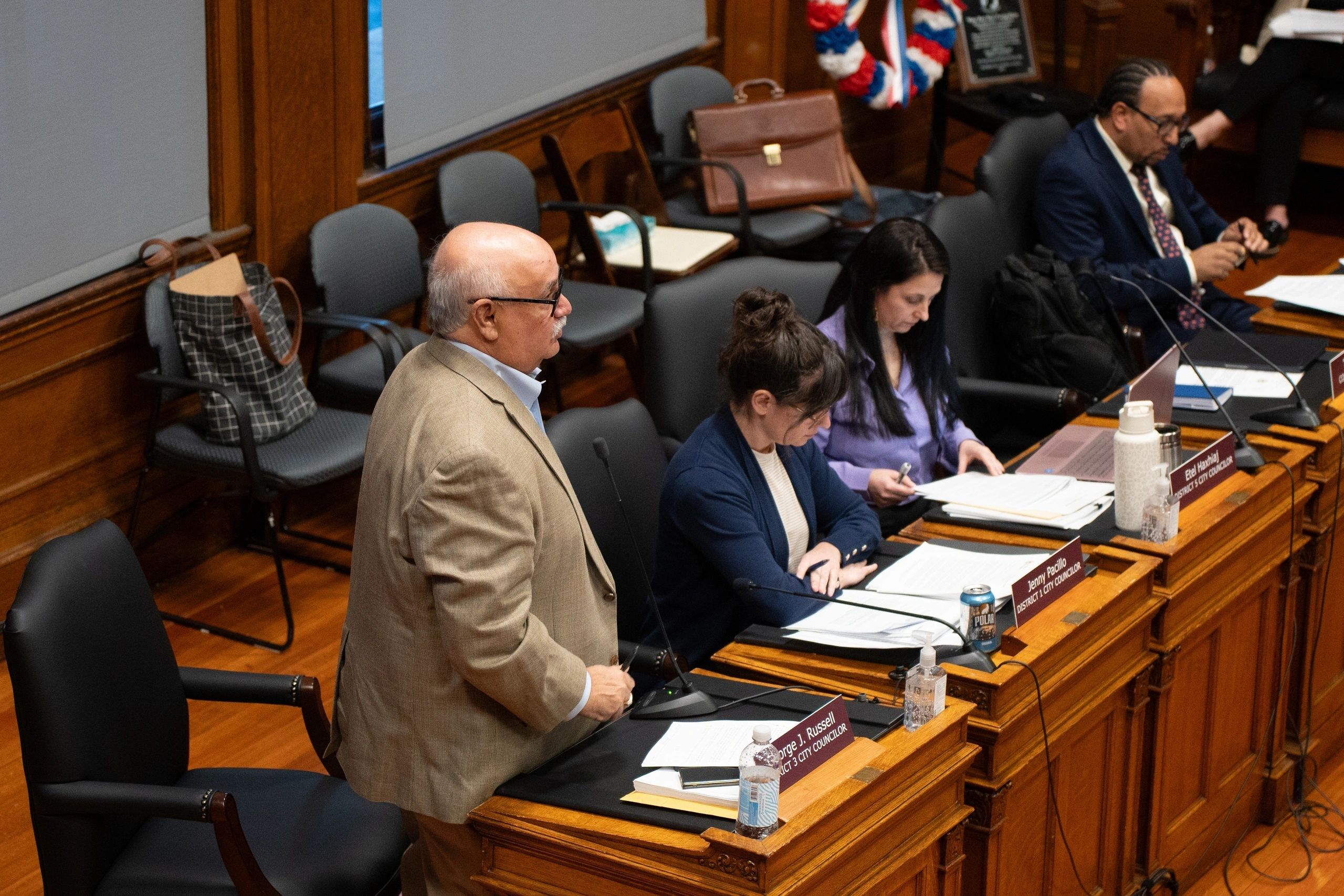 George Russell (left, standing) speaks at Tuesday's council meeting (photo by Bromly Domingo/the Worcester Guardian)