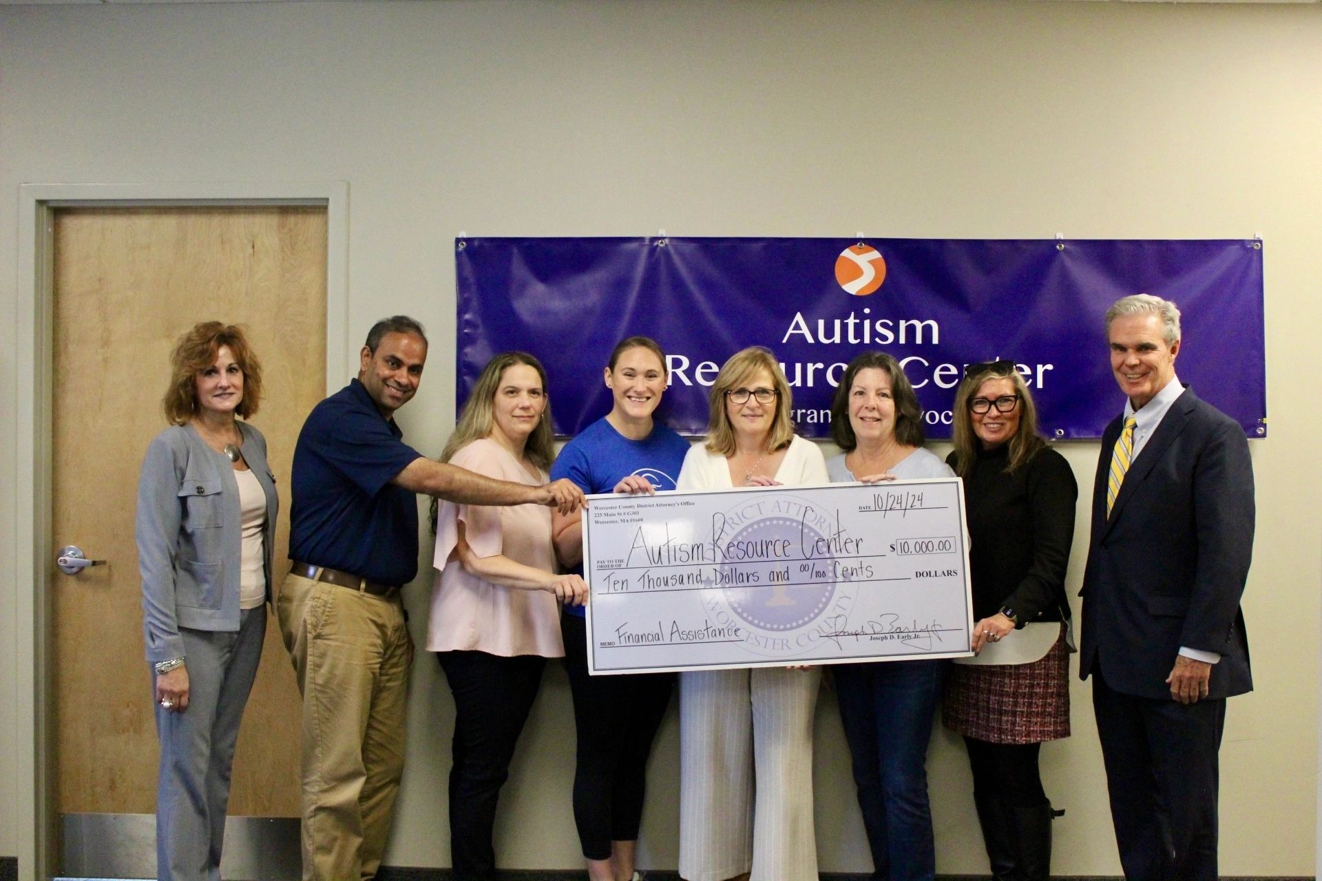 Photo 1: (from left to right) Lainie Petrou from the Worcester County District Attorney’s Office, Logi Nathan from the British Swim School of Blackstone Valley, Julie LeBeau of the Autism Resource Center, Janine LaPrade, swim instructor at Worcester Fitness, Kristen Cariglia, Director of the Autism Resource Center, Kelly Sampson of the Worcester JCC, Eileen Shea from the Worcester County District Attorney’s Office, and Worcester County District Attorney Joseph D. Early, Jr. (photo submitted)