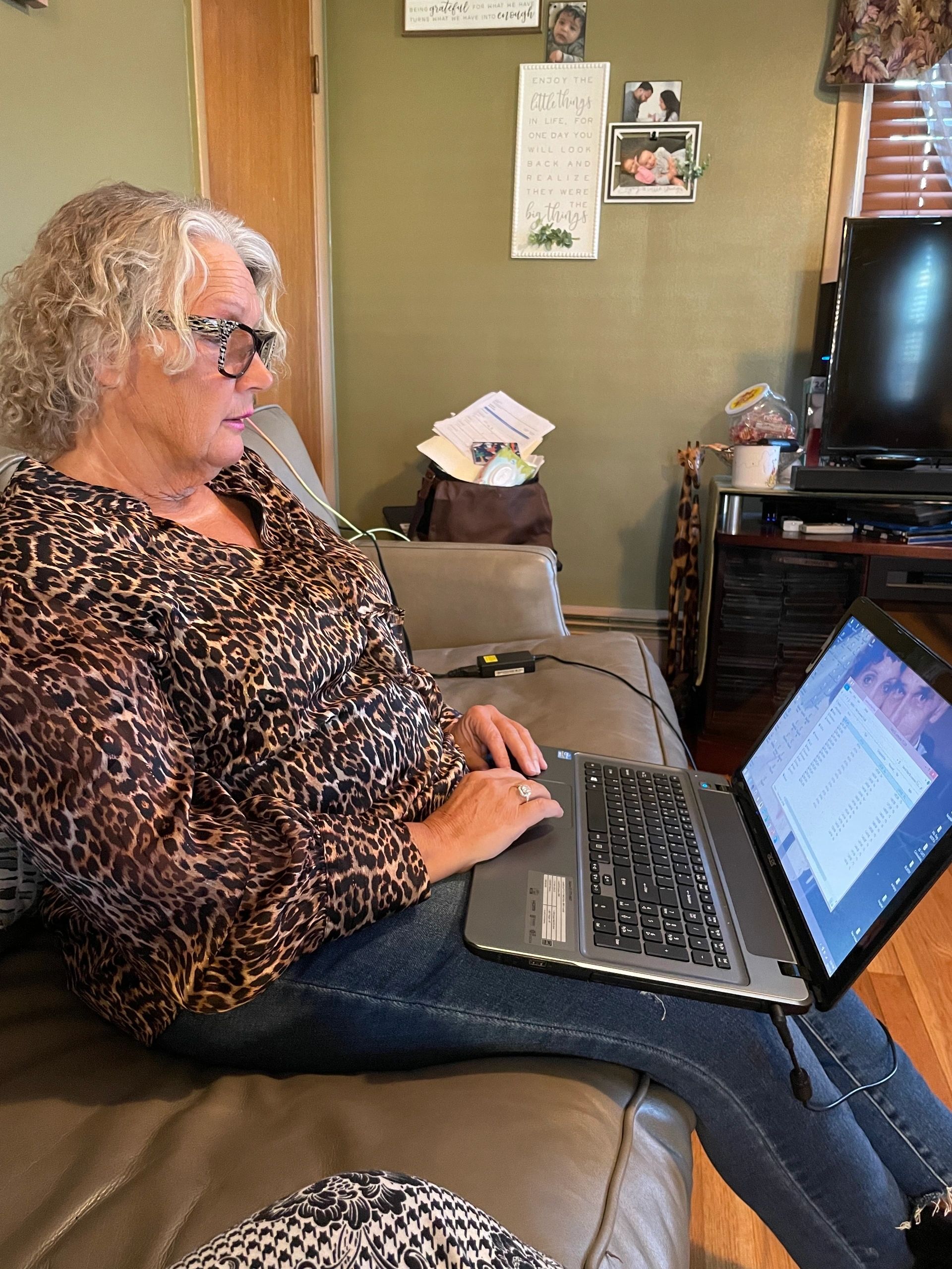 Christi Berry, Travis Monroe's mom, looks through her files (photo by Christine Quirk)