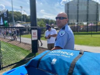Brewster Ambulance Advanced EMT Manny Garcia provides medical standby at a Holy Cross football game (photo courtesy)