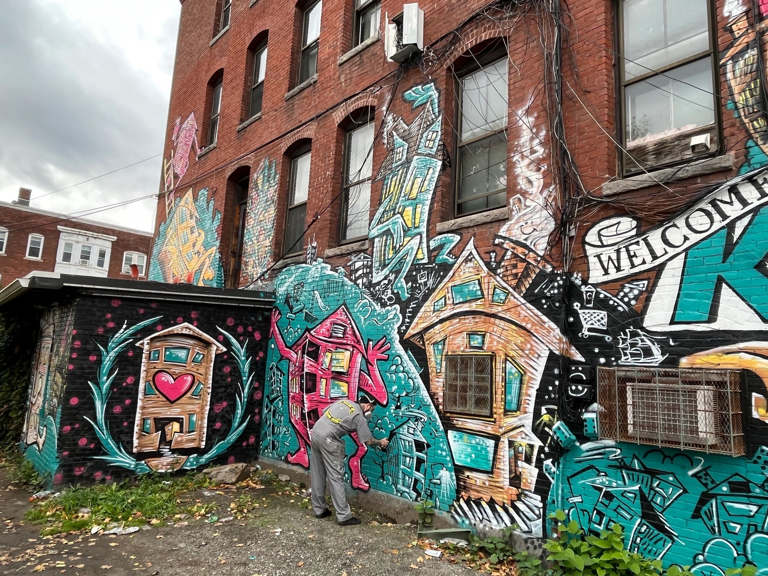 Eamon Gillen paints his mural on Hotel Vernon in Kelley Square in Worcester (Photo by Kiernan Dunlop) 