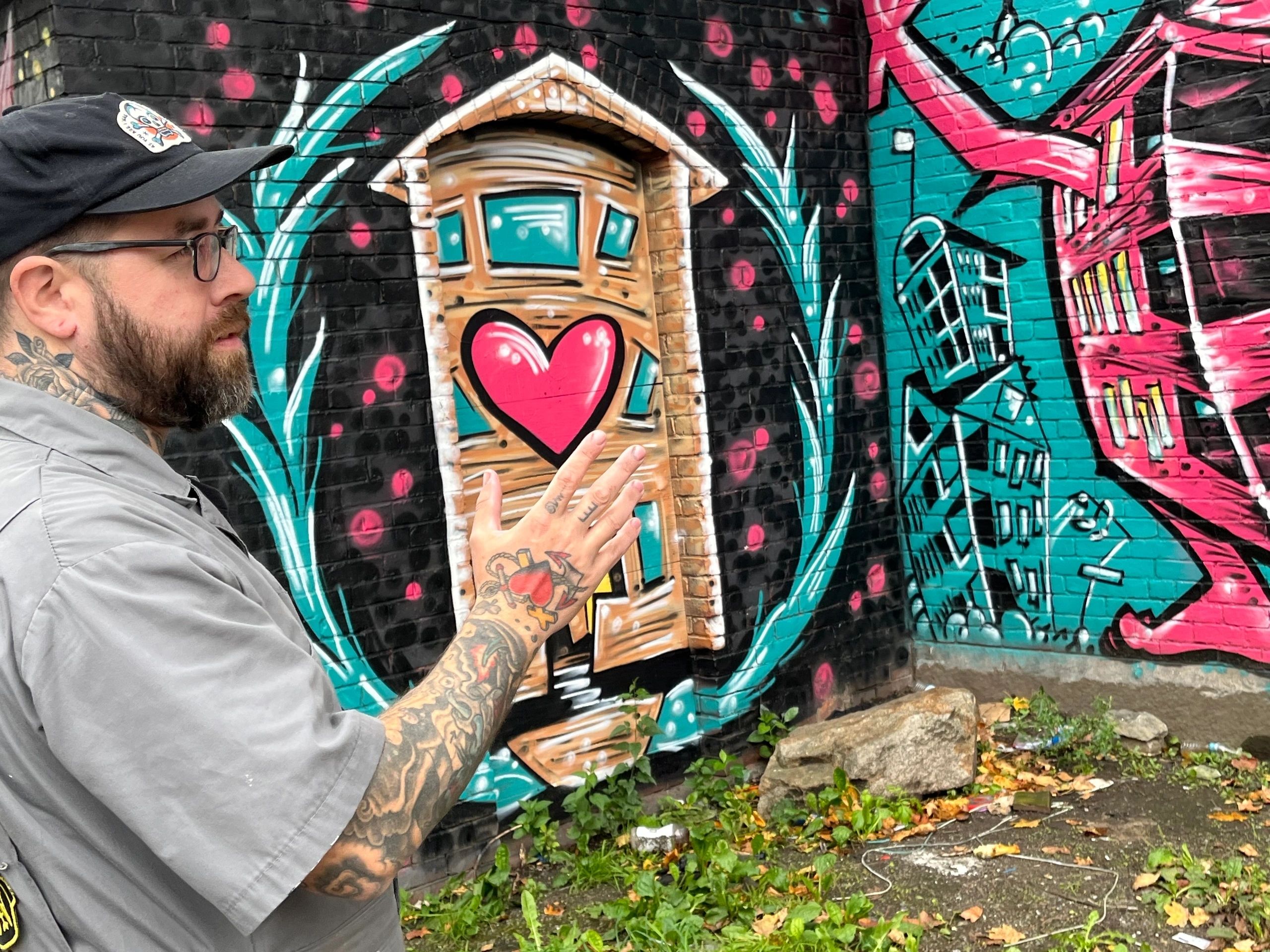 Eamon Gillen describes his mural on Hotel Vernon in Kelley Square (Photo by Kiernan Dunlop) 