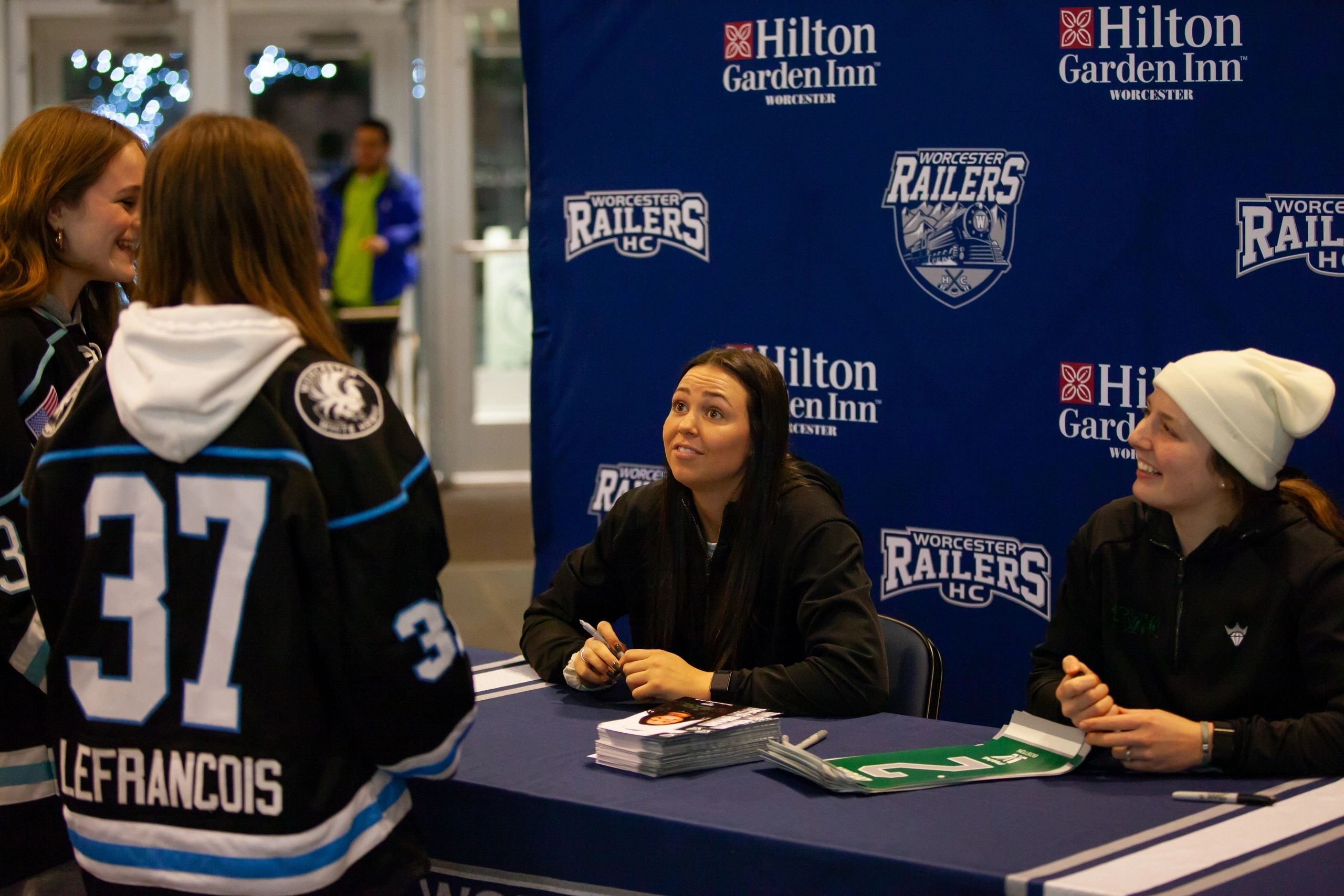 Taylor Girard and Emily Brown from the PWHL sign autographs at last year's event (photo submitted)