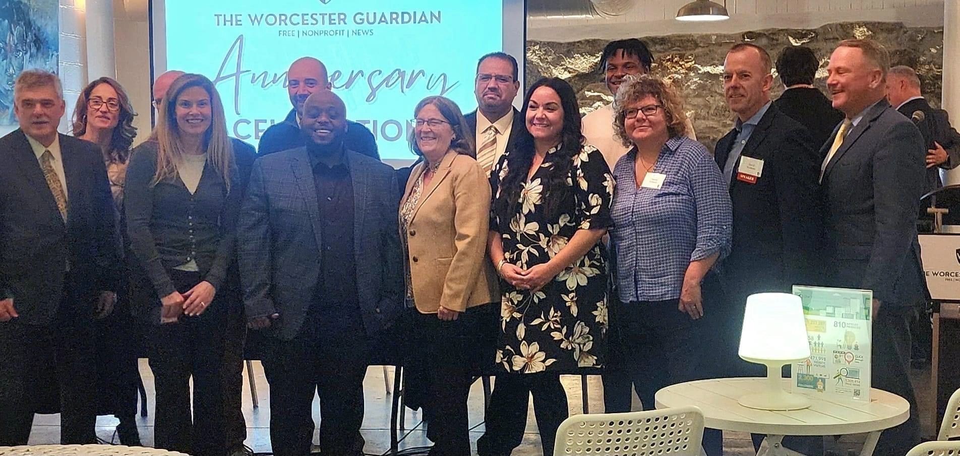 Board members and Guardian staff celebrate the one year milestone