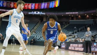 Assumption’s Tayeshawn Cunningham-Pemberton drives to the hoop against Nova Southeastern in the Division 2 NCAA Tournament Elite 8 (photo credit: Assumption Athletics )