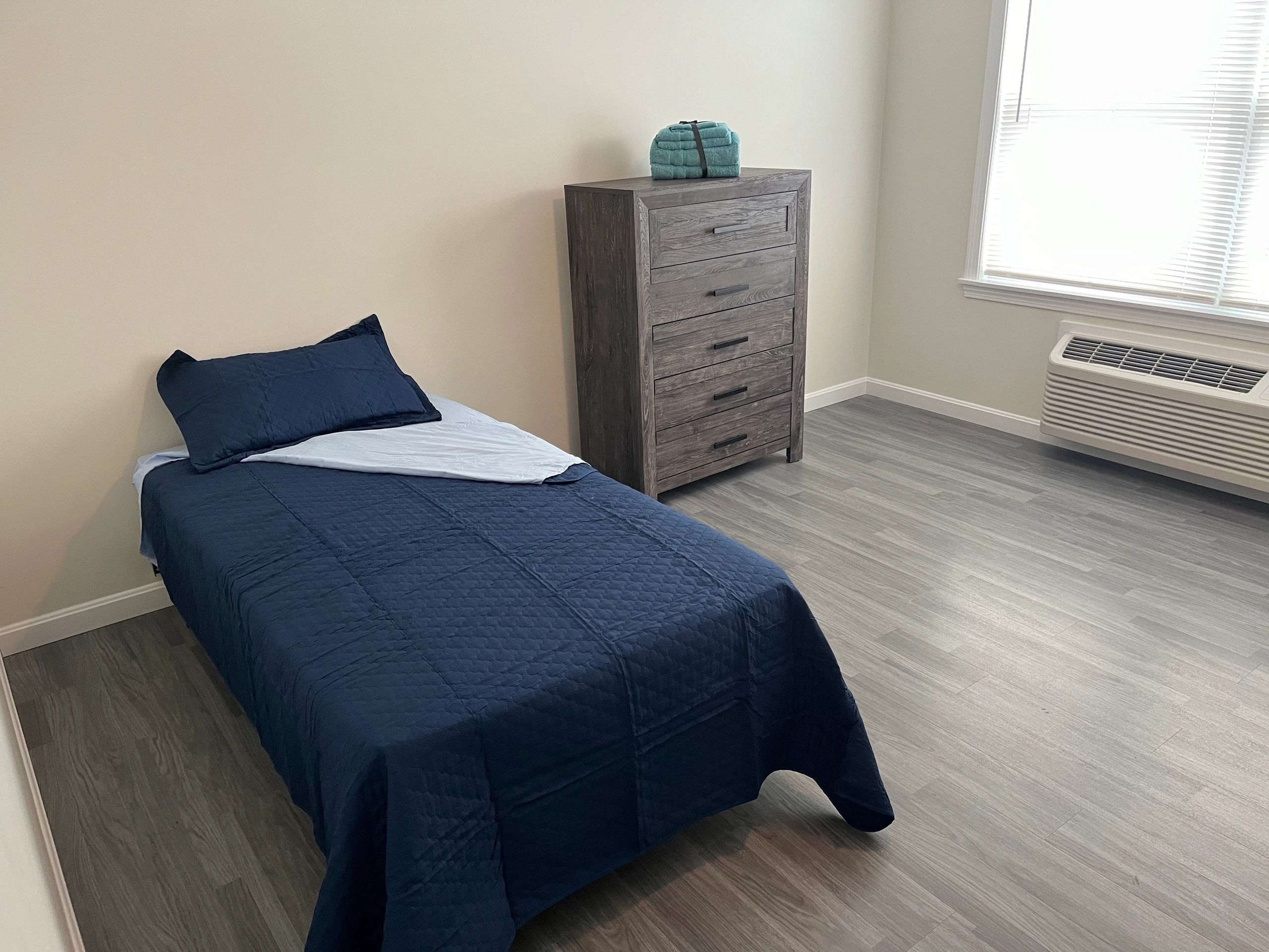 A room at 6 Wyman Street, a building with permanent supportive housing. (Photo by Kiernan Dunlop) 