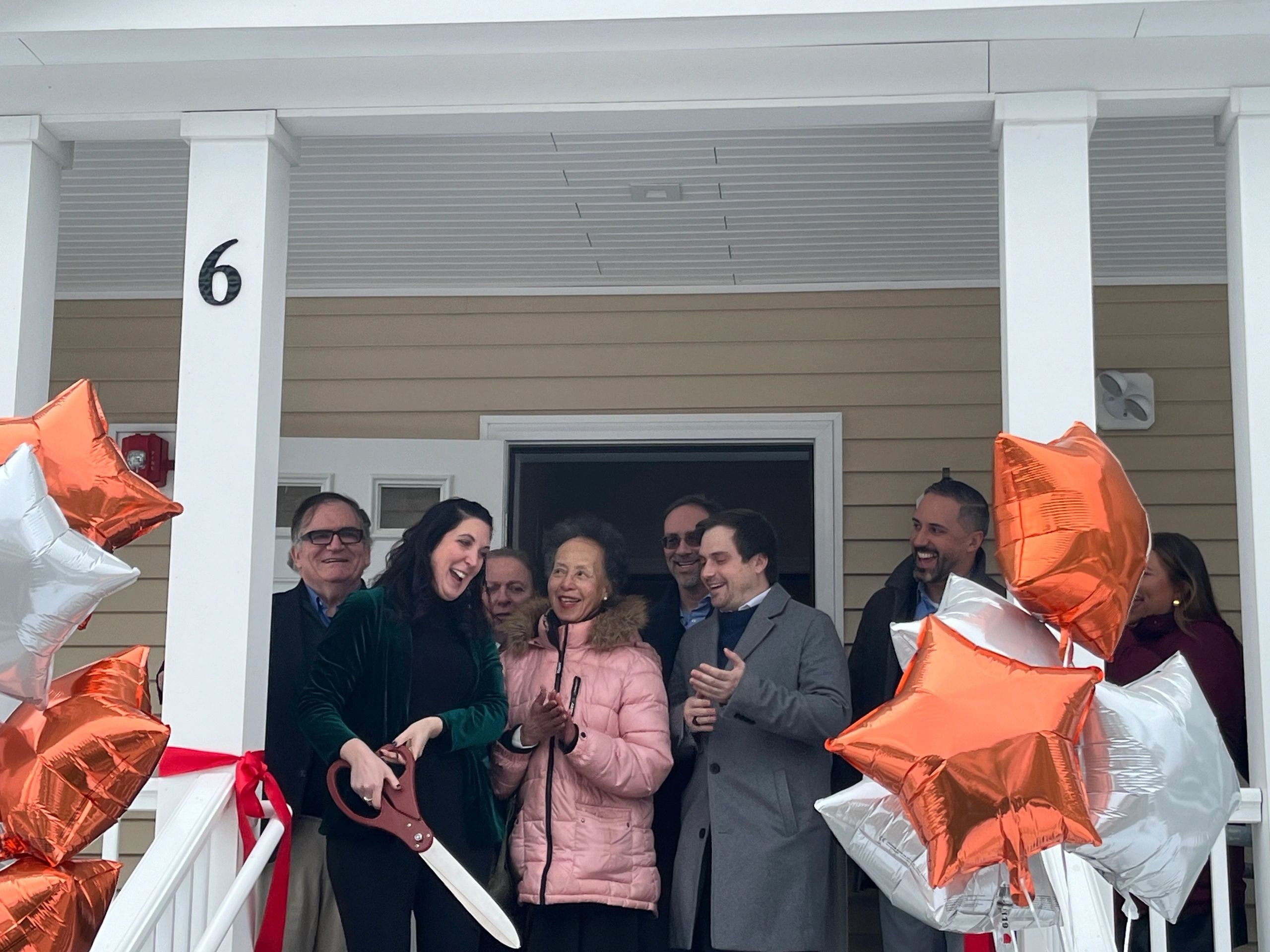 A ribbon cutting opening 15 units of permanent supporting housing at 6 Wyman Street (Photo By Kiernan Dunlop)