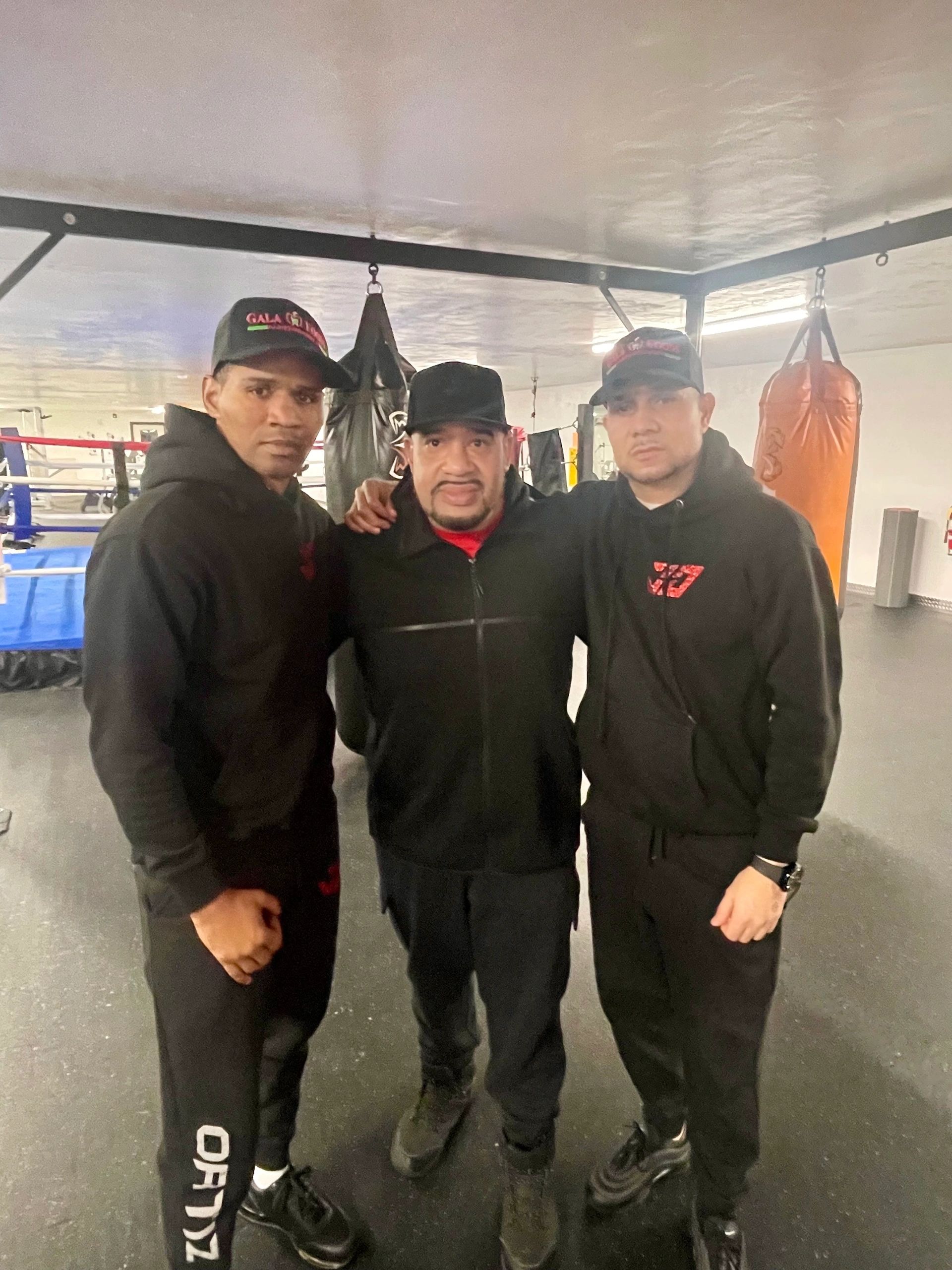 From left, Jamaine Ortiz’s assistant trainer Lester Diaz, head trainer Rocky Gonzalez and manager Jose Rodriguez (Photo by Bill Doyle)