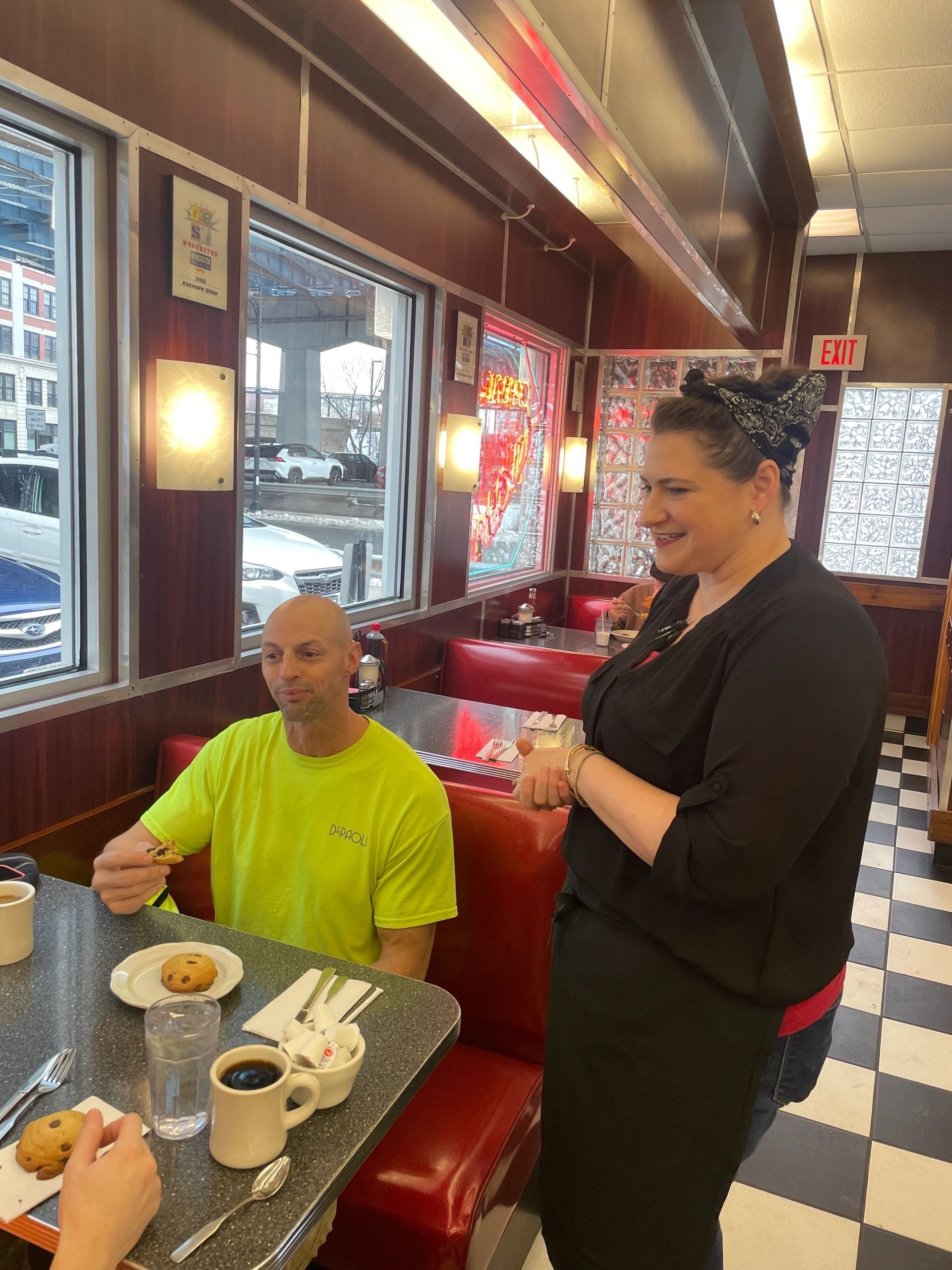 New Kenmore Diner owner Christon Paddock talks to customer Ed King (photo by Bill Doyle)