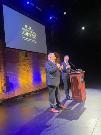 City Manager Eric D. Batista and ASL interpreter Simon Martinez at the State of the City address (photo by Bill Doyle)
