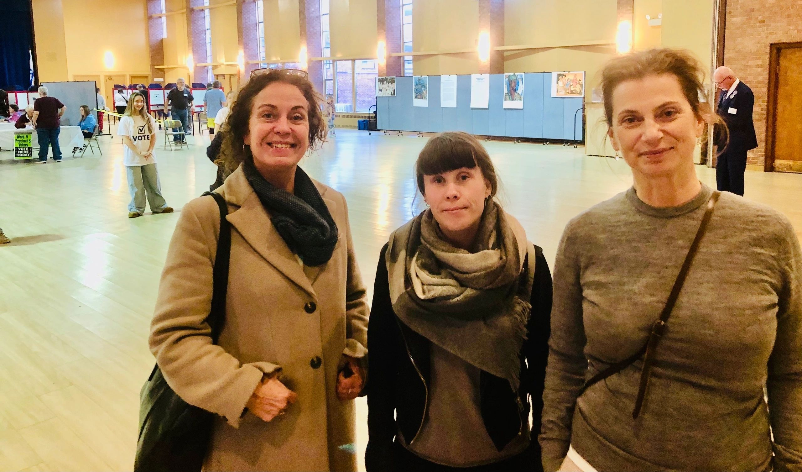 Karina Topel and Emeli Eriksson from Sweden and Romina Yttesen from Norway checked in on the Worcester election while visiting the states (photo by Charlene Arsenault)