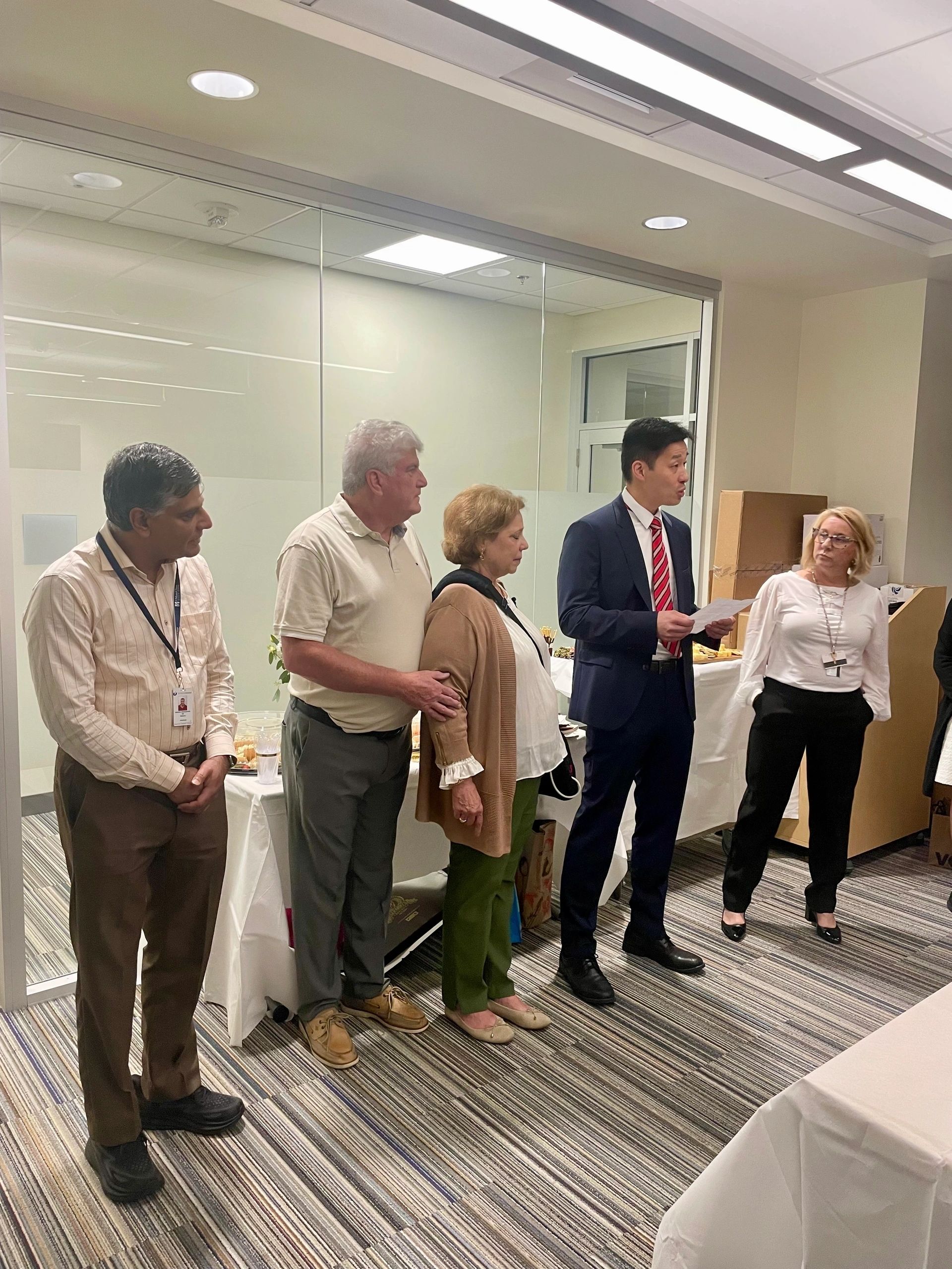 From left, Dr. Vaikom Mahadevan, Stephen Lyon, Wendy Lyon, Dr. Jeffrey Shih and Stacy Keddy at a reunion celebration at UMass Memorial Medical Center Thursday (photo by Bill Doyle)