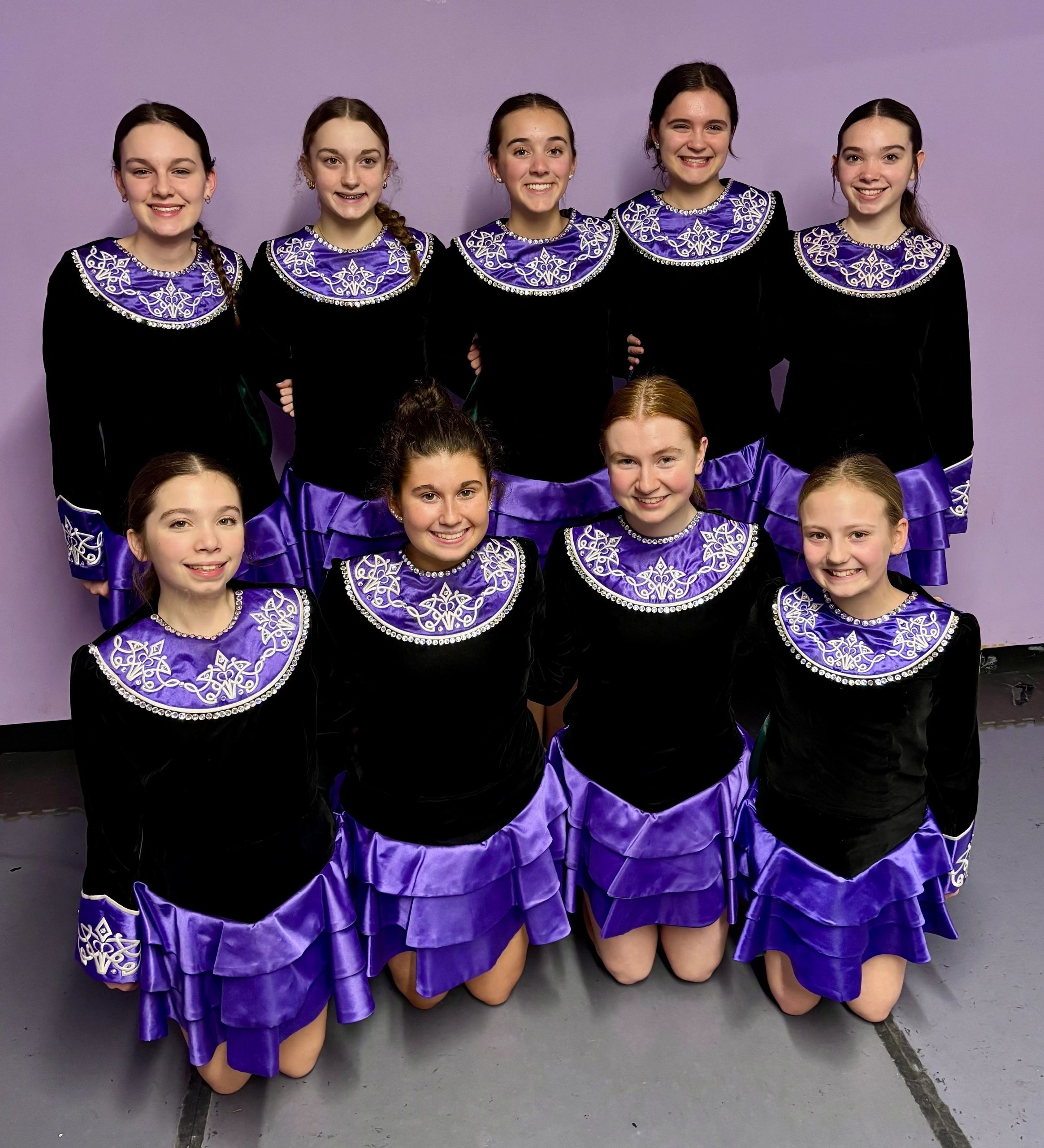Step dancers from the McInerney School of Irish Dance pose at their studio in Auburn. In front row from left are: Neve Leach, Ella Daugherty, Casey Bartley and Bridget Muenzberg. In back row from left are: Nora Wiser, Madison Kadis, Maddie Faucher, Ruthie Grendol and Faith Leach (photo by Bill Doyle)