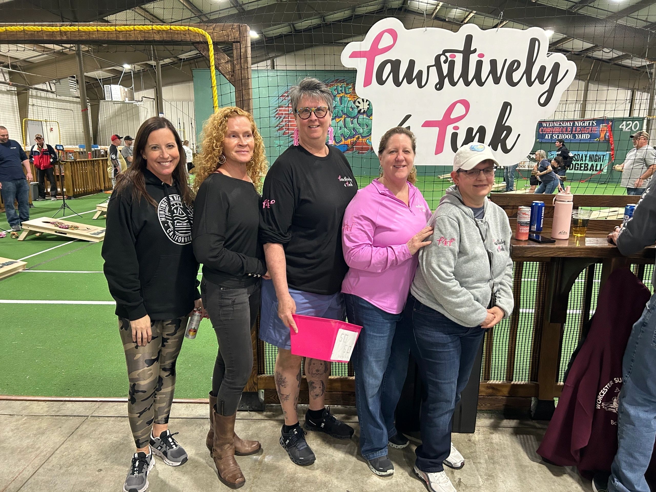The third imagPawsitively Pink board members at a recent cornhole tournament (photo submitted)