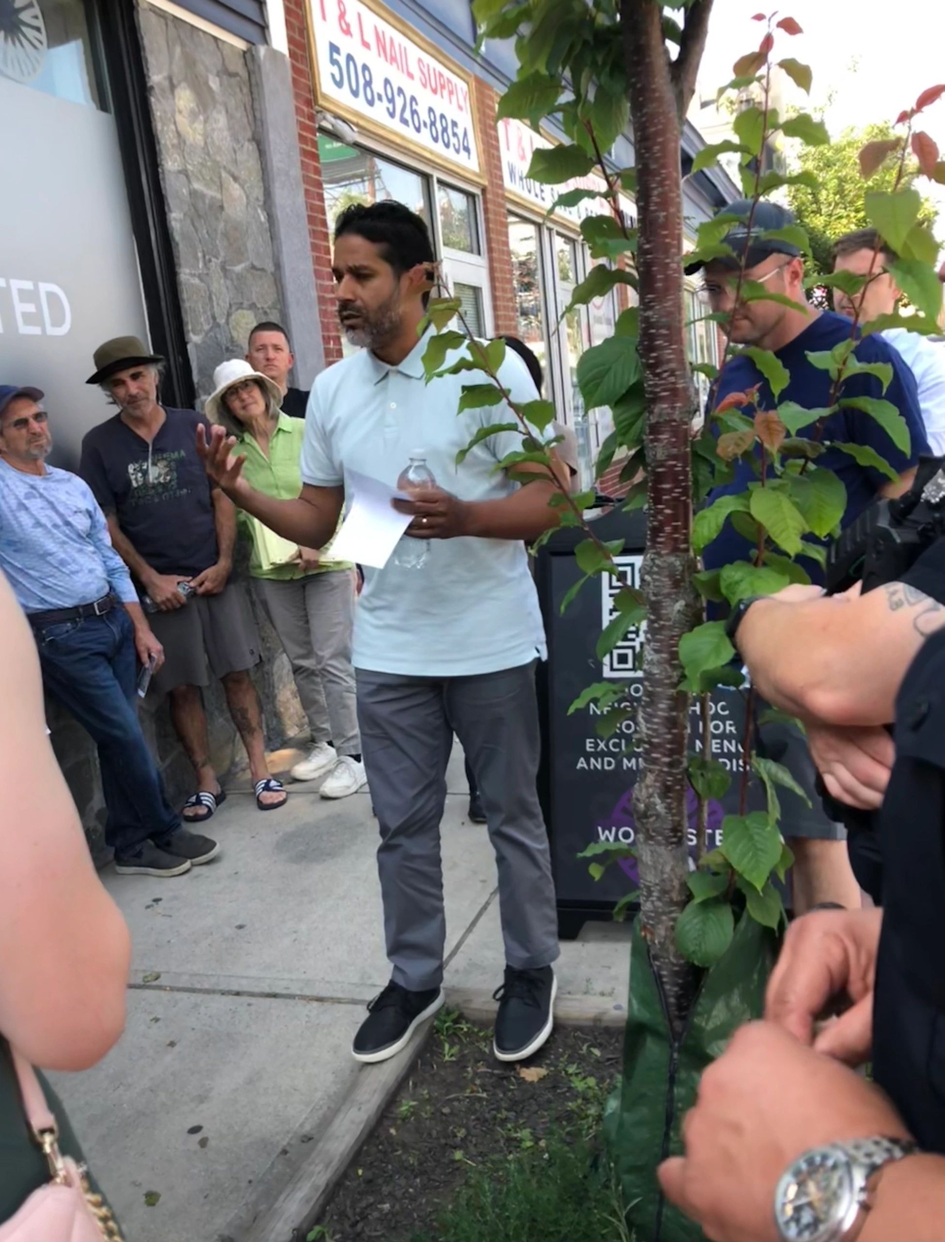 District 4 Councilor Luis Ojeda talks to the group that joined the Mayor's Walk (photo by Charlene Arsenault)