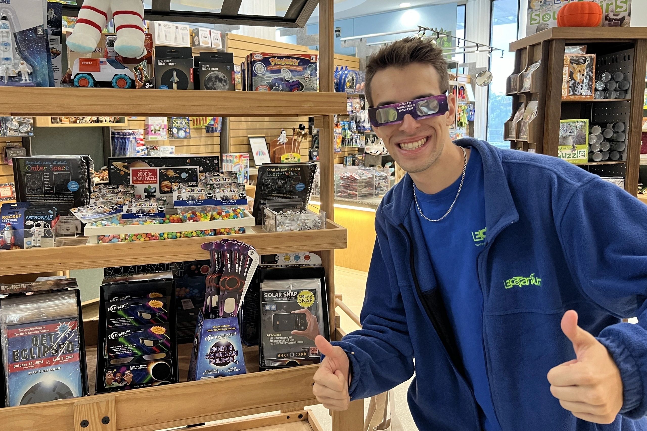 Museum educator Jackson Morse trying out our eclipse glasses available in the EcoTarium store (photo courtesy the EcoTarium)