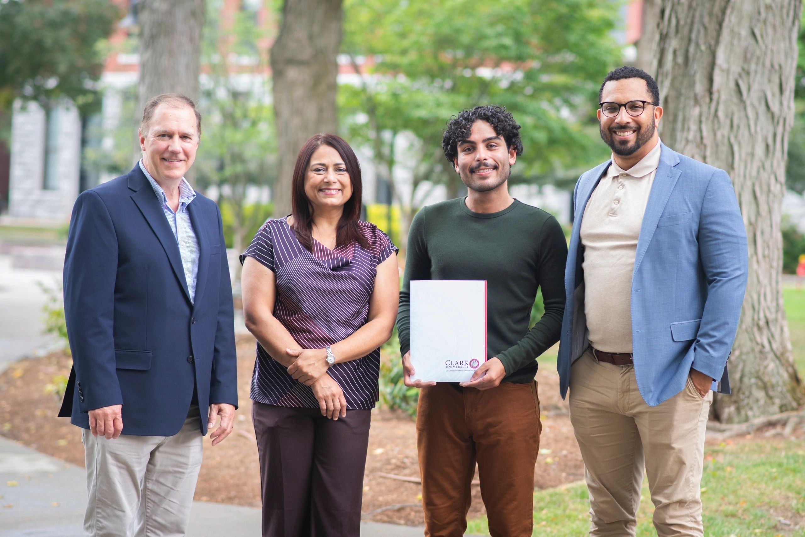 From L-R:  Clark University President David Fithian poses with Geography Professor Rinku Roy Chowdhury