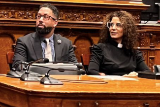 Worcester City Councilors Sean Rose and Sarai Rivera look on as their colleague honor their last meeting as councilor Dec. 19.