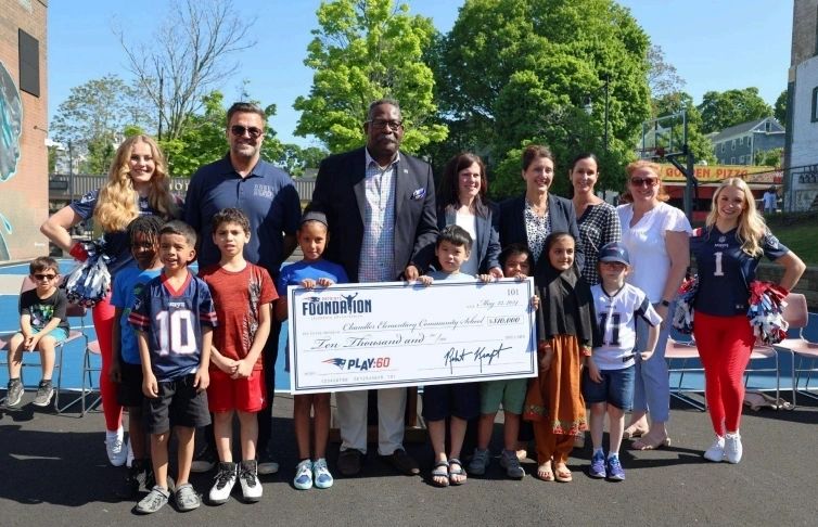 Chandler Elementary Community School and district leadership accept a $10,000 grant from the New England Patriots Foundation (photo courtesy Kraft Sports and Entertainment)