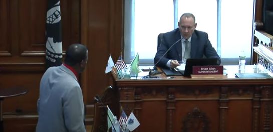 Jermaine Johnson discusses the mastery-based grading policy with Superintendent Brian Allen at Thursday's school committee meeting