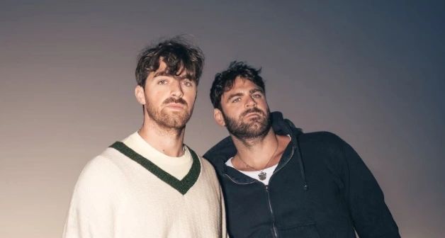 The Chainsmokers gaze into the distance with serious intent, perhaps considering the hazards of smoking cigarettes (photo credit: the Chainsmokers)
