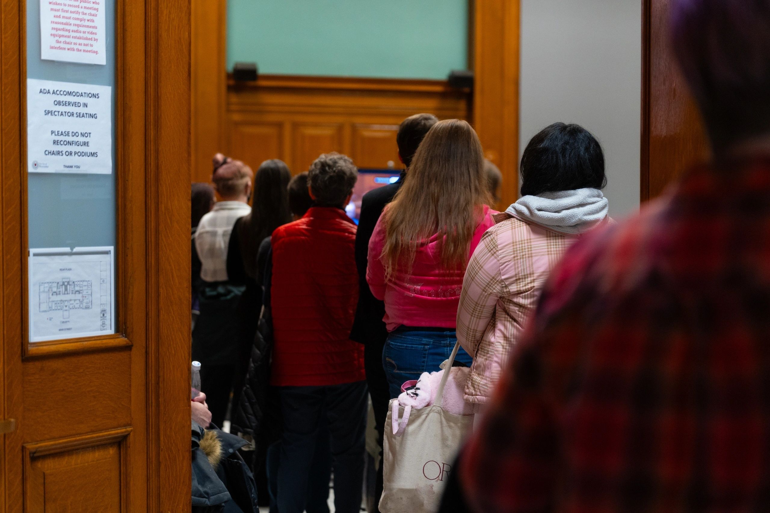 Standing room only: residents spill outside of council chambers (photo by Bromly Domingo)
