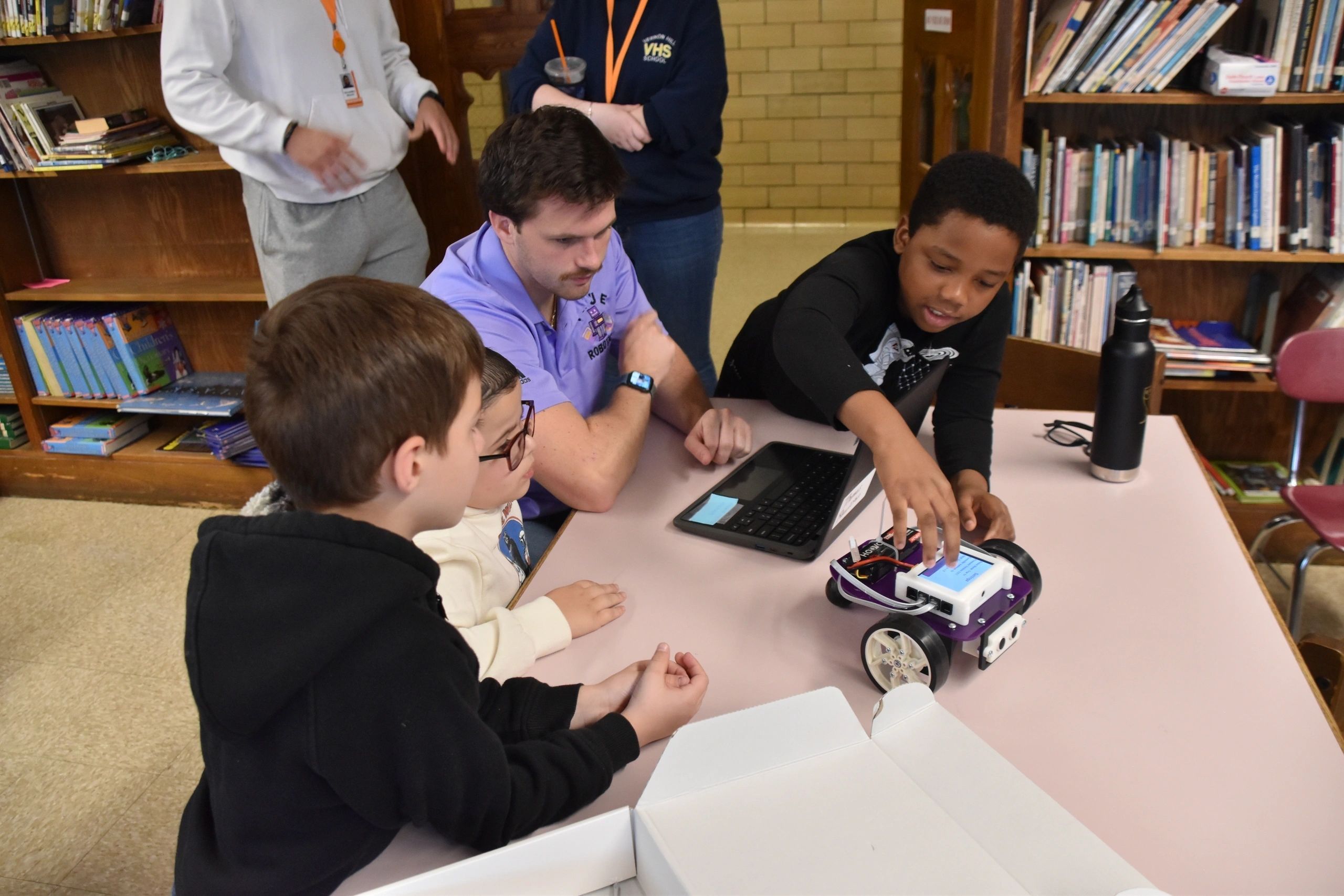 True Robotics president and co-founder Anthony Galgano helps Vernon Hill students at a recent program at the school (photo submitted)