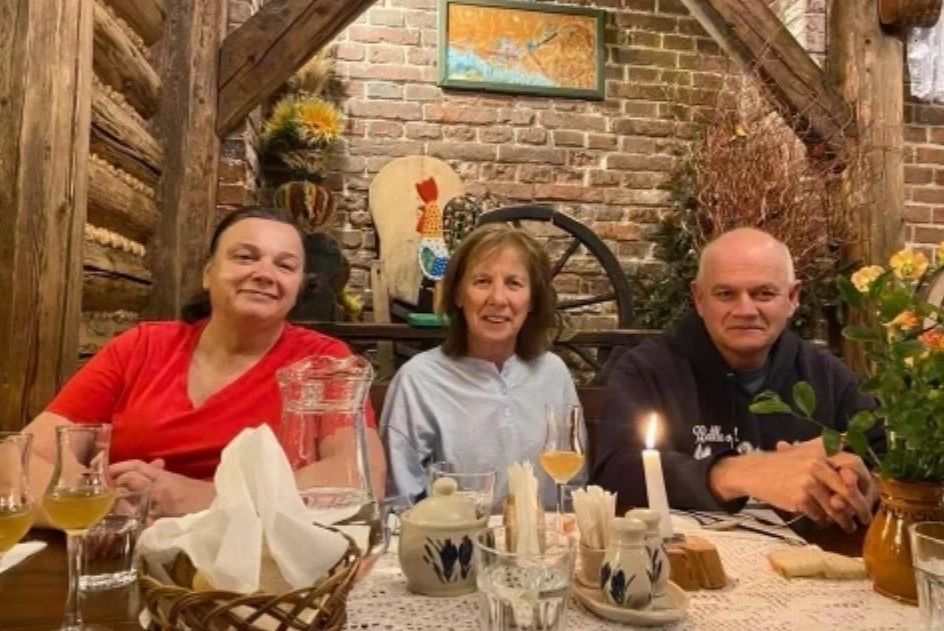 Father Riley's sister Mary Dowd (left), his sister Kathy Cavan and Father Walter Riley on vacation in Poland in 2022 (photo submitted)
