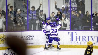 Michael Abgrall celebrates with Jack Seymour after scoring the game-winning goal in overtime vs. AIC to send Holy Cross to the semifinals (photo credit: Holy Cross)