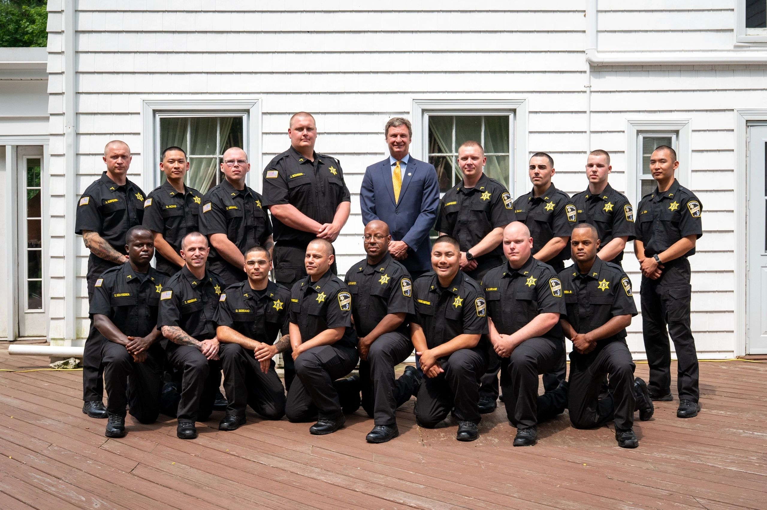 Sheriff Evangelidis poses with the 16 new officers after graduation (photo submitted)